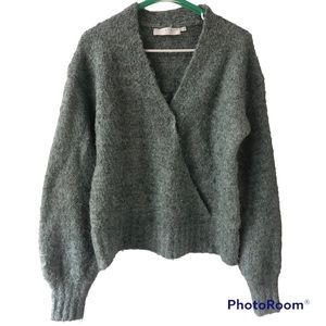 A medium size cardigan that is light pastel aquarium blue green color from Astr